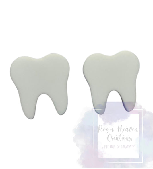 White wisdom tooth earrings.