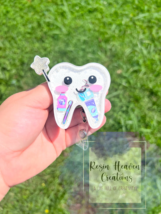 Tooth fairy shaker badge reel