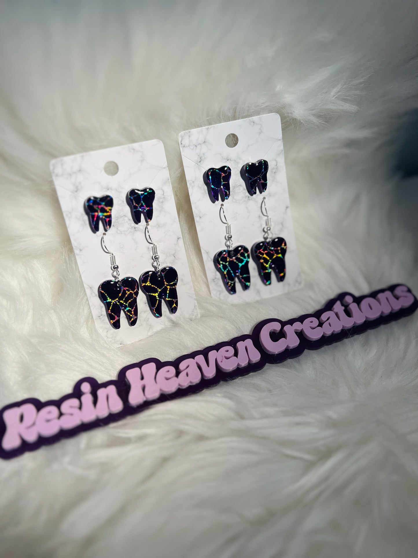 Purple crackle tooth earring set.